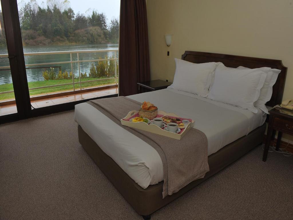 Postel nebo postele na pokoji v ubytování Hotel Naguilan