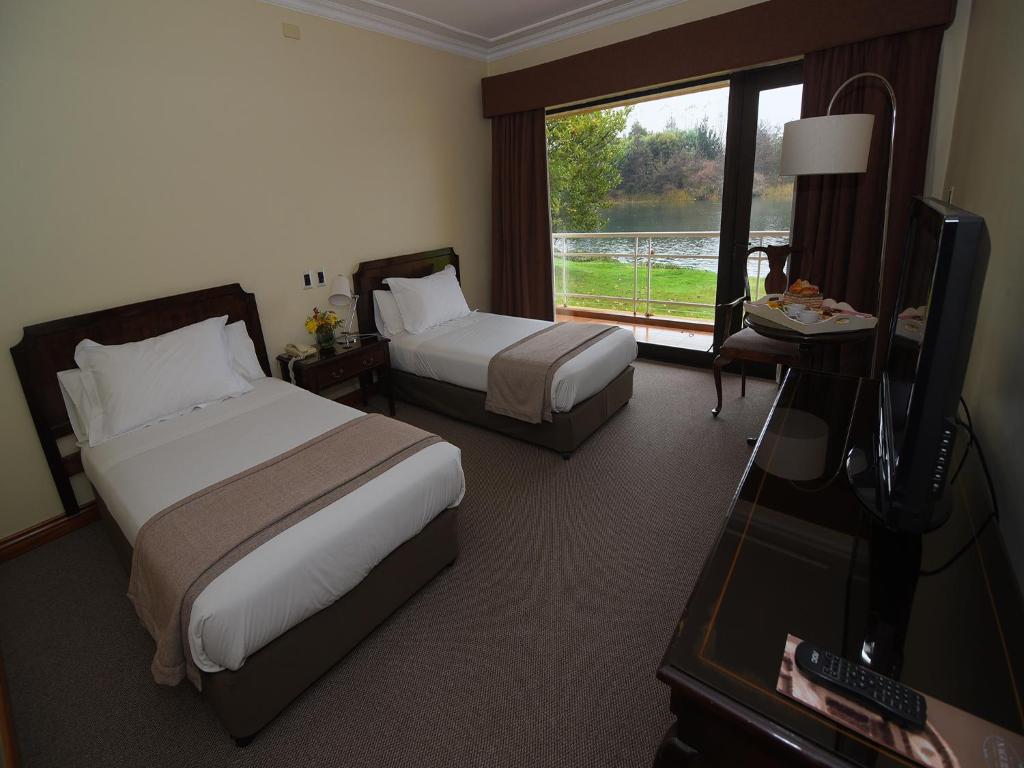Postel nebo postele na pokoji v ubytování Hotel Naguilan