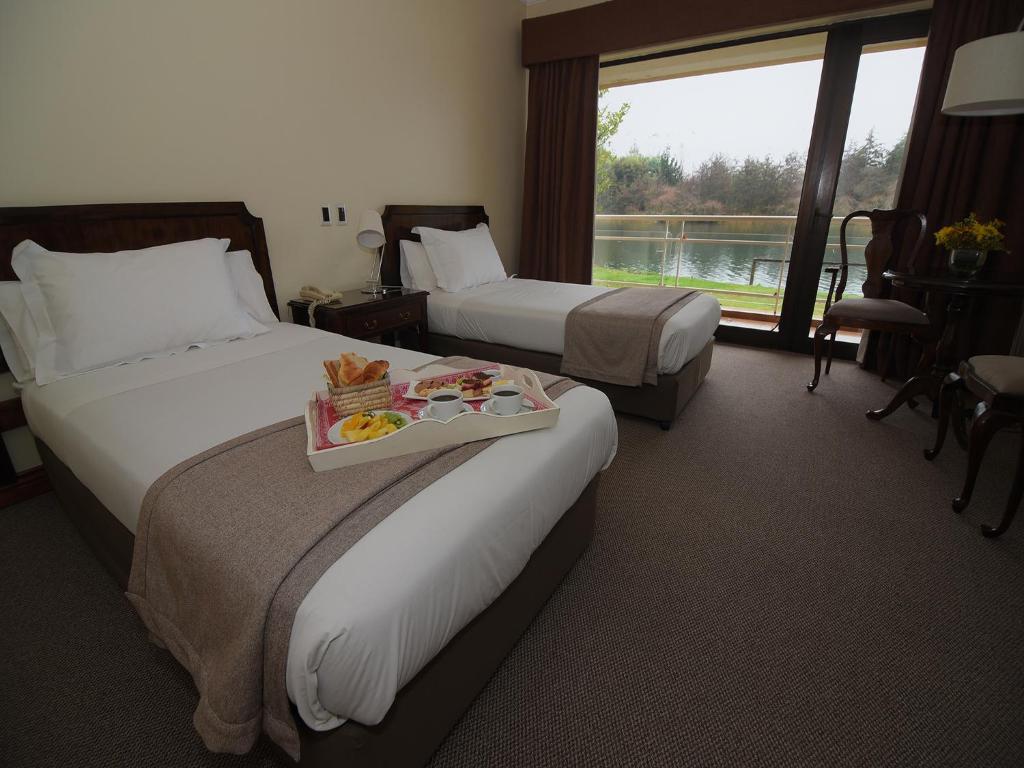 Postel nebo postele na pokoji v ubytování Hotel Naguilan