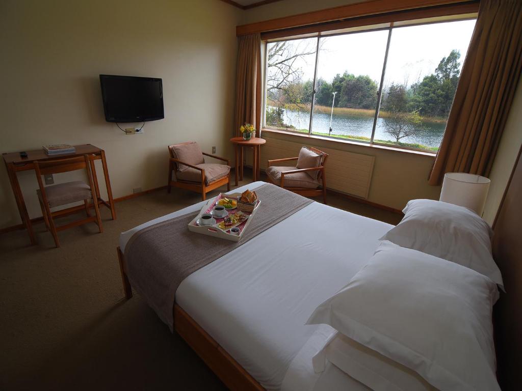 Postel nebo postele na pokoji v ubytování Hotel Naguilan