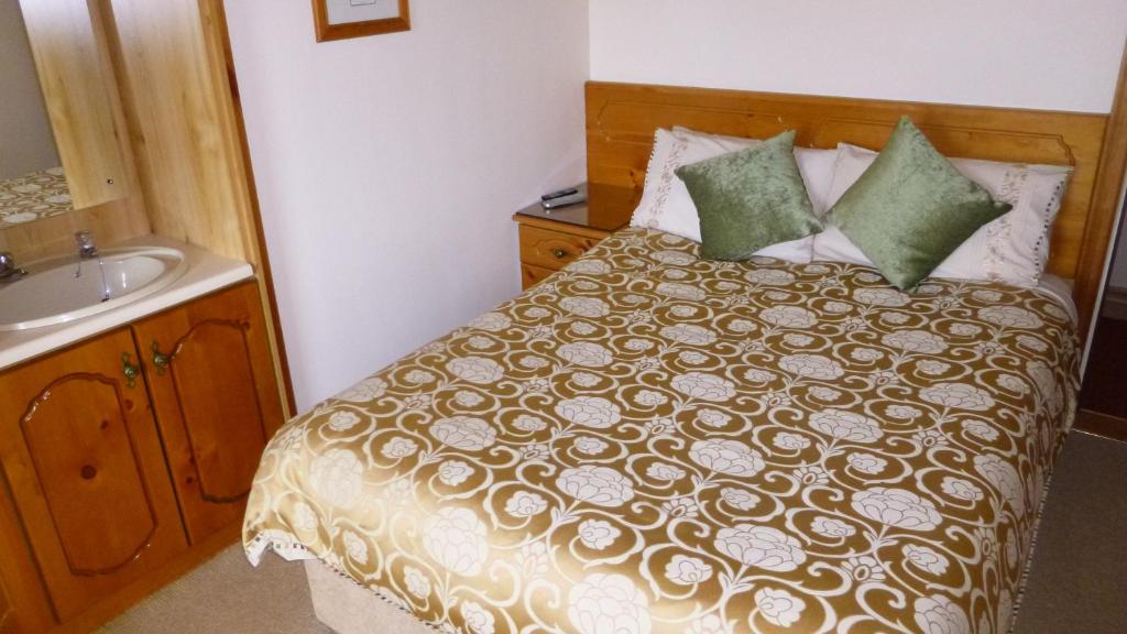 Postel nebo postele na pokoji v ubytování Ponderosa B&B