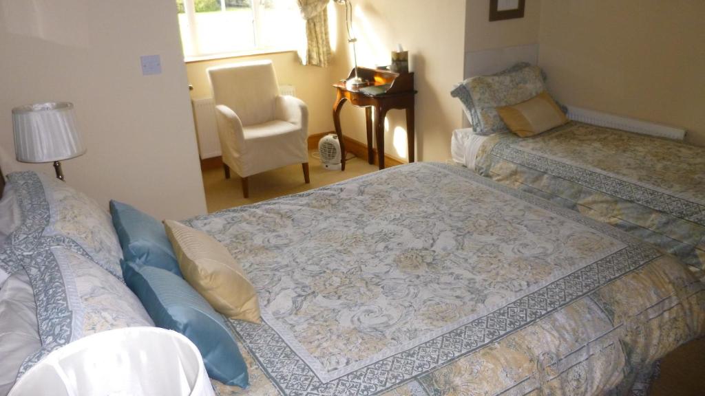Postel nebo postele na pokoji v ubytování Ponderosa B&B