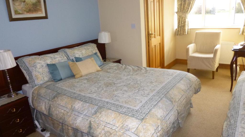 Postel nebo postele na pokoji v ubytování Ponderosa B&B