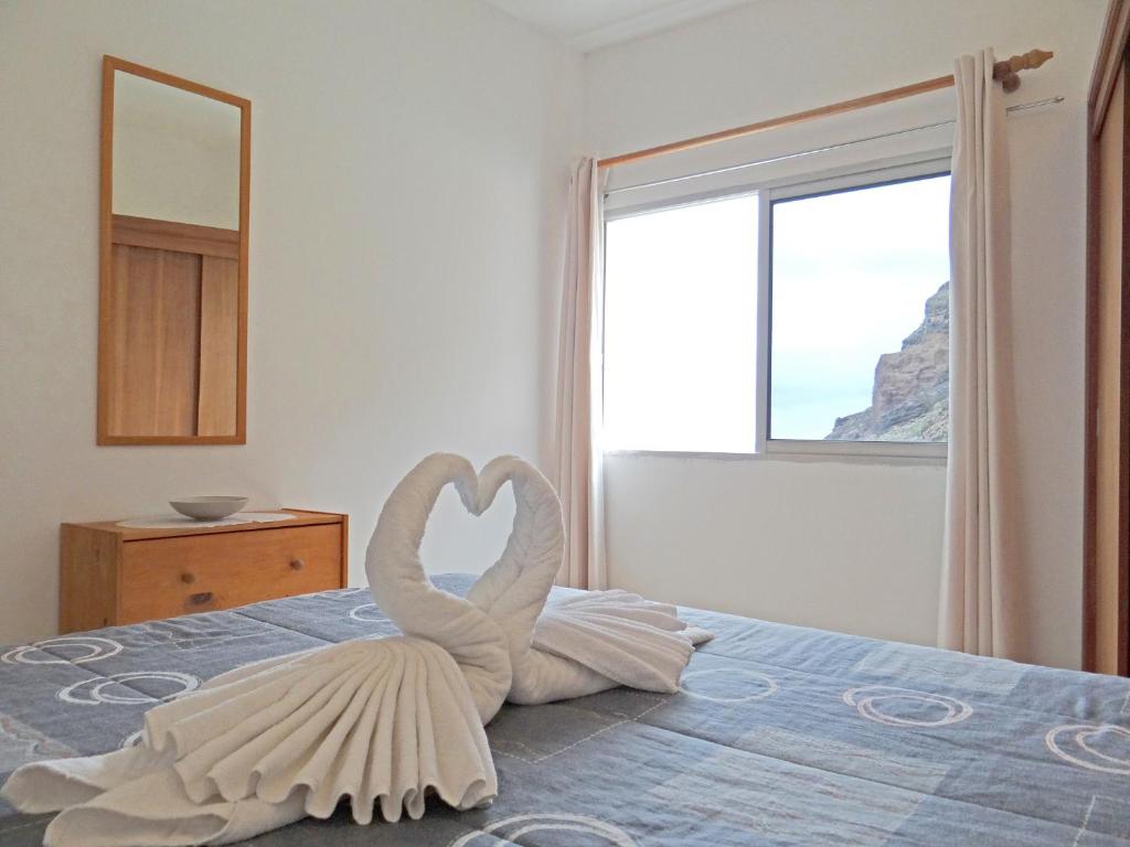 Postel nebo postele na pokoji v ubytování Apartamentos Domínguez