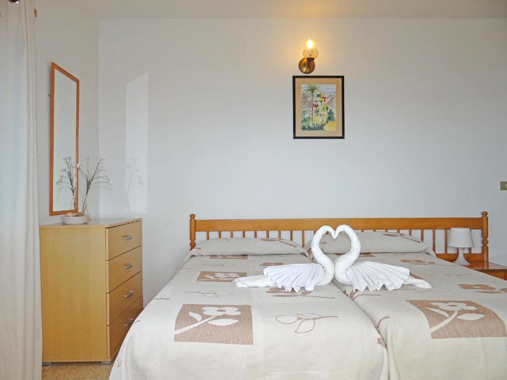 Postel nebo postele na pokoji v ubytování Apartamentos Domínguez