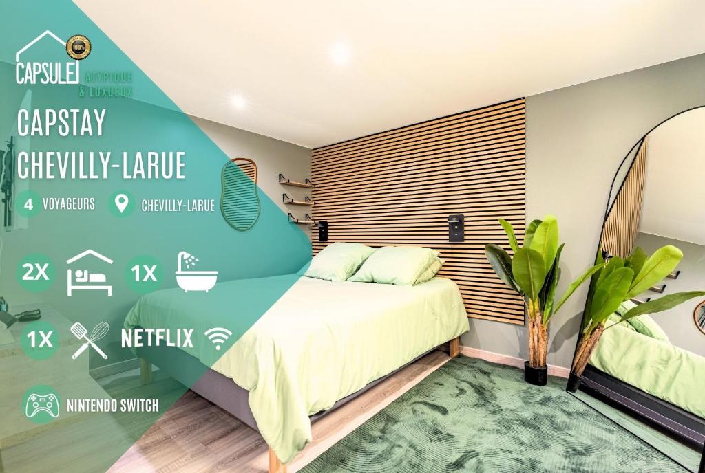 LarueにあるCasptay Chevilly-Larue - proche aéroport Orlyのベッドと緑の壁のある寝室