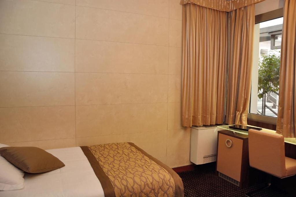 Posteľ alebo postele v izbe v ubytovaní LH Hotel Sirio Venice