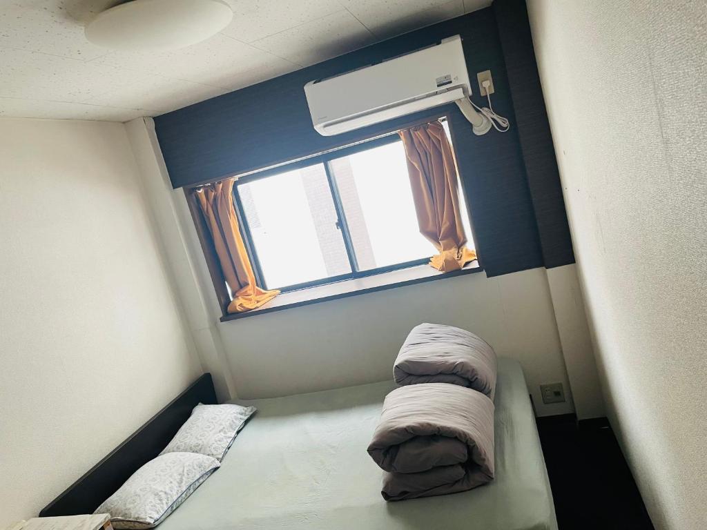 Postel nebo postele na pokoji v ubytování Lucky Hostel