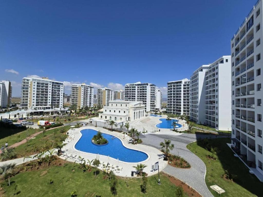 an aerial view of a city with tall buildings at Luxury Apartments with Pool View at Caesar Resort in Iskele