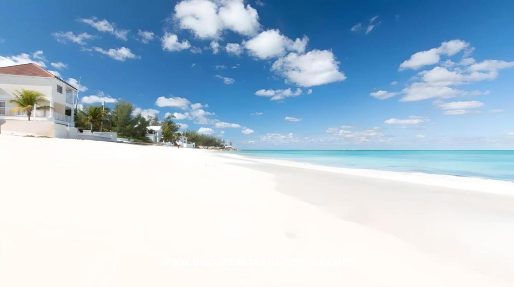 a white beach with a house and the ocean at Oceanfront Bungalow Cable Beach 2 Bedroom in Macbride