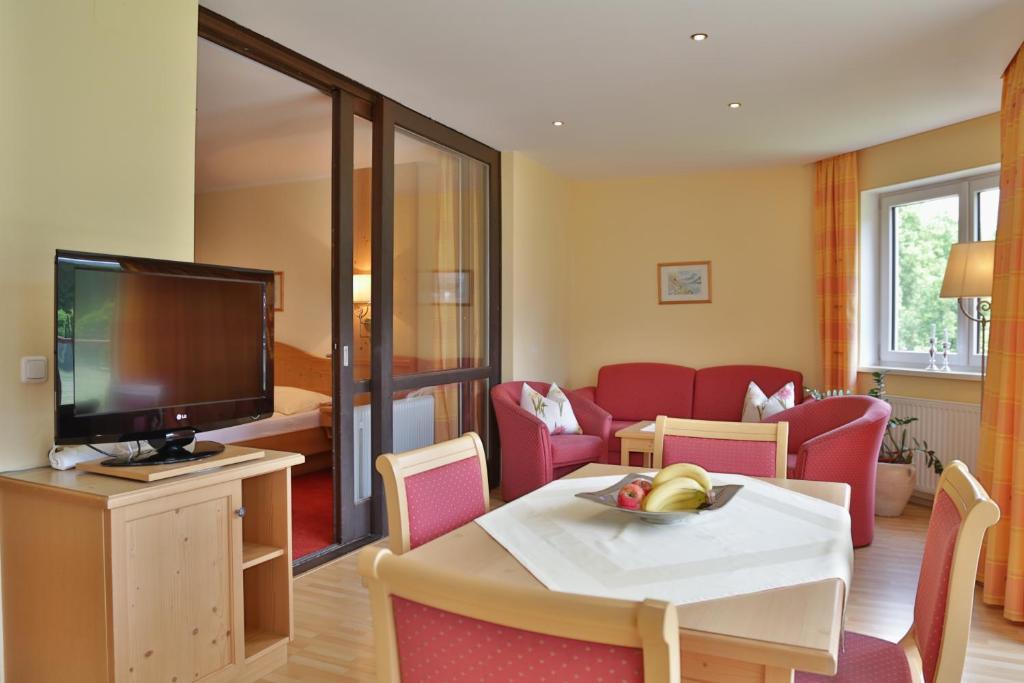 Televízia a/alebo spoločenská miestnosť v ubytovaní Appartement Sport Girbl