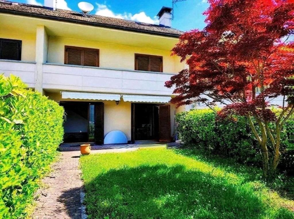 an exterior view of a house with a yard at La VILLETTA in Masera