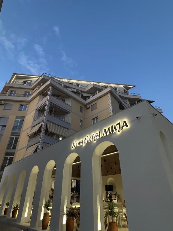 a building with a sign in front of it at Kompleksi Muja in Velipojë