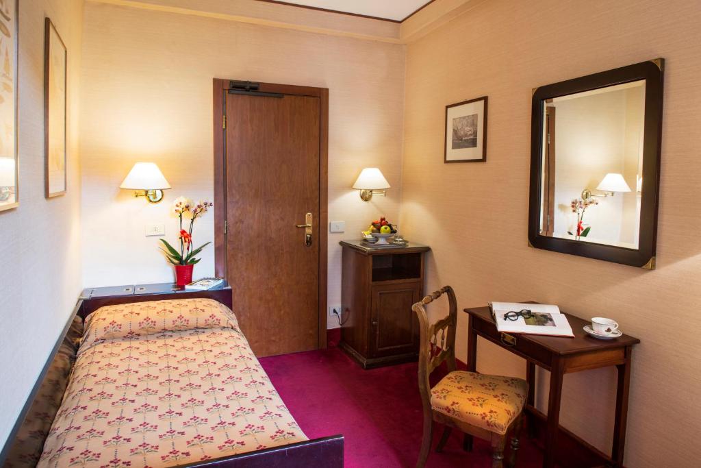Postel nebo postele na pokoji v ubytování Hotel Agli Alboretti