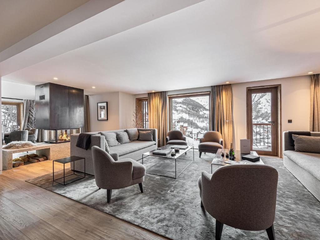 a living room with couches and chairs at Chalet skis aux pieds avec bain nordique et hammam, 12-14 pers - FR-1-570-3 in Saint-Martin-de-Belleville