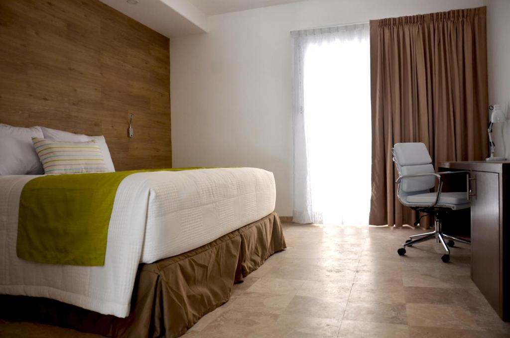 Postel nebo postele na pokoji v ubytování Hotel Catedral La Paz