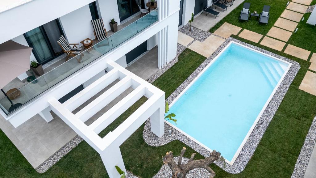 an overhead view of a swimming pool in a yard at Mare Blue The Vintage Suite in Skala Rachoniou