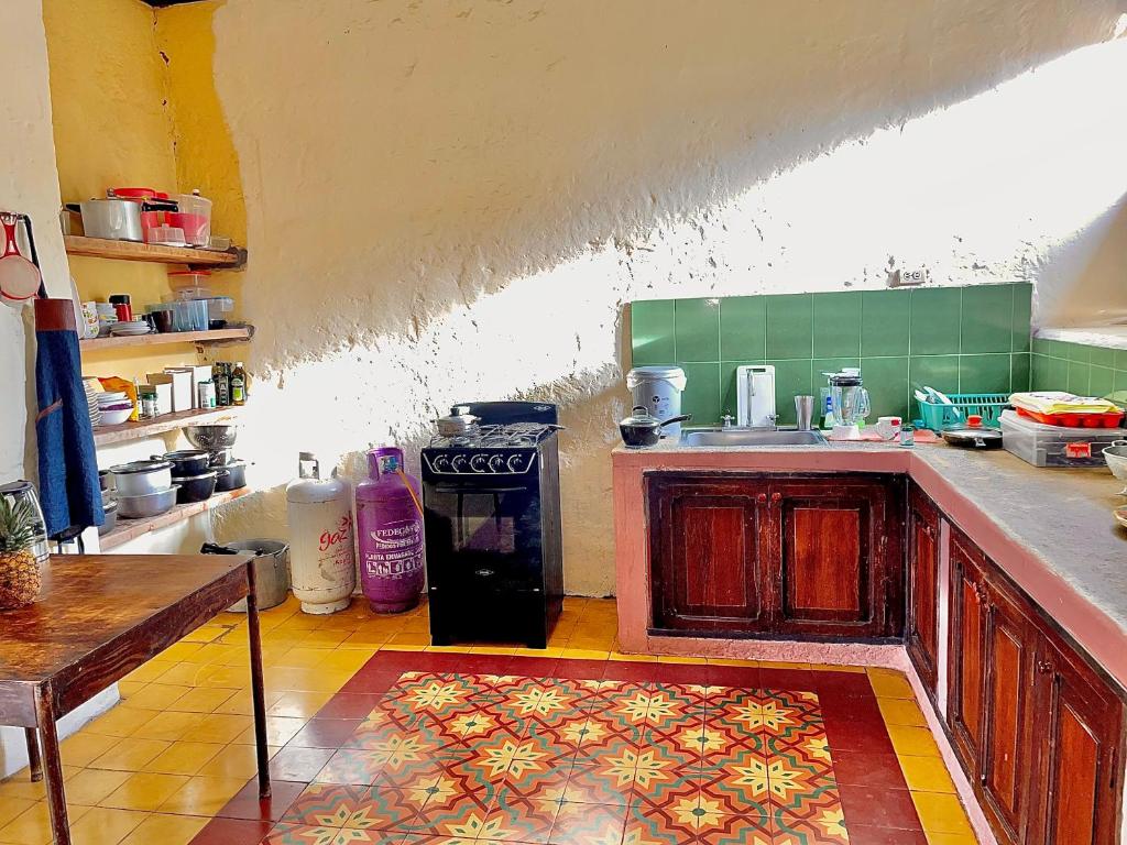 a kitchen with a sink and a counter top at Casa Real - Encanto Colonial in Sopetran