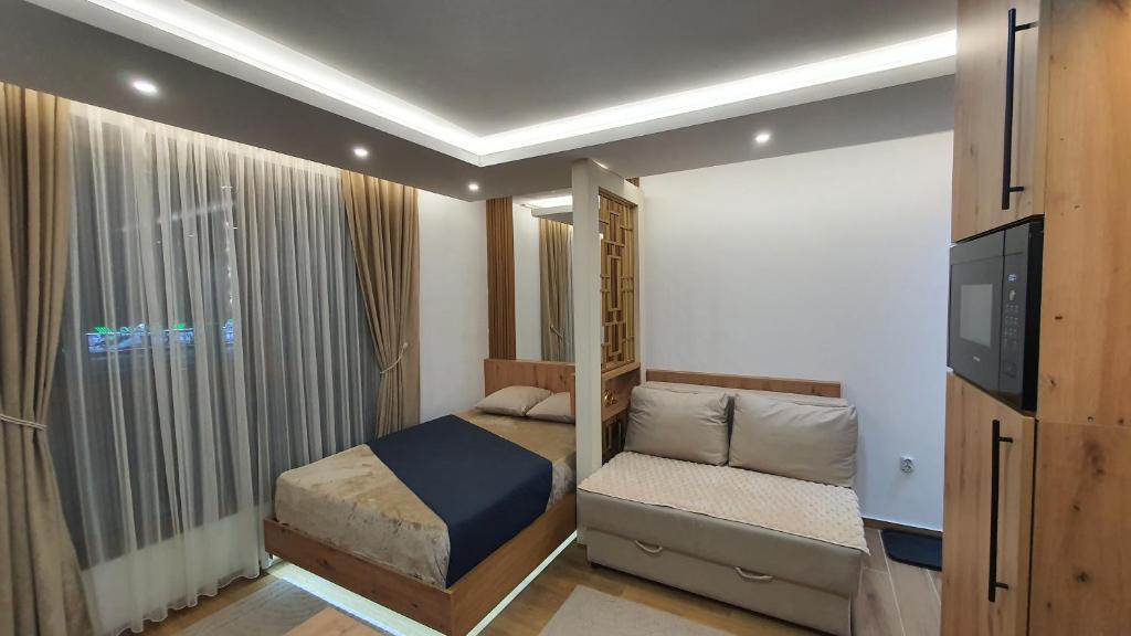 Giường trong phòng chung tại Apartmani Kasandra Wellness Spa A203 President Kop Kopaonik