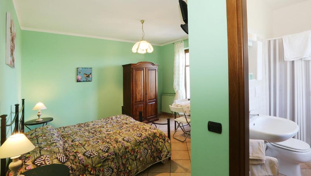 Postel nebo postele na pokoji v ubytování Agriturismo Al Brich