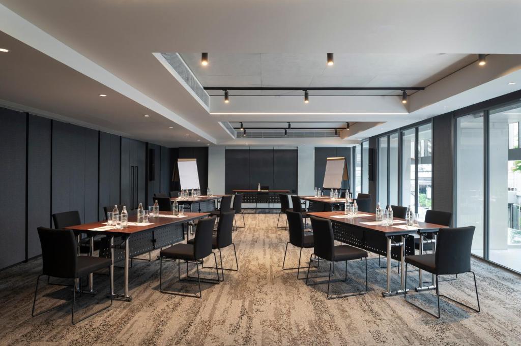 A private meeting room set up for a formal conference or business session.