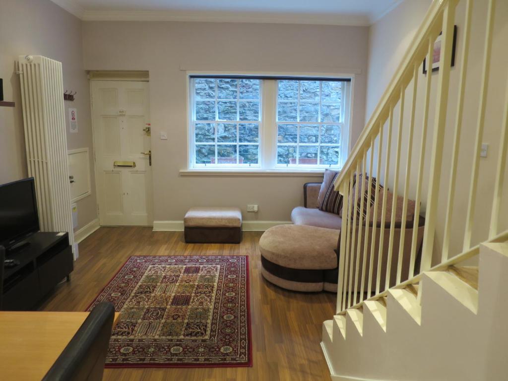 a living room filled with furniture and a window at Our City - King Stable Lane in Edinburgh