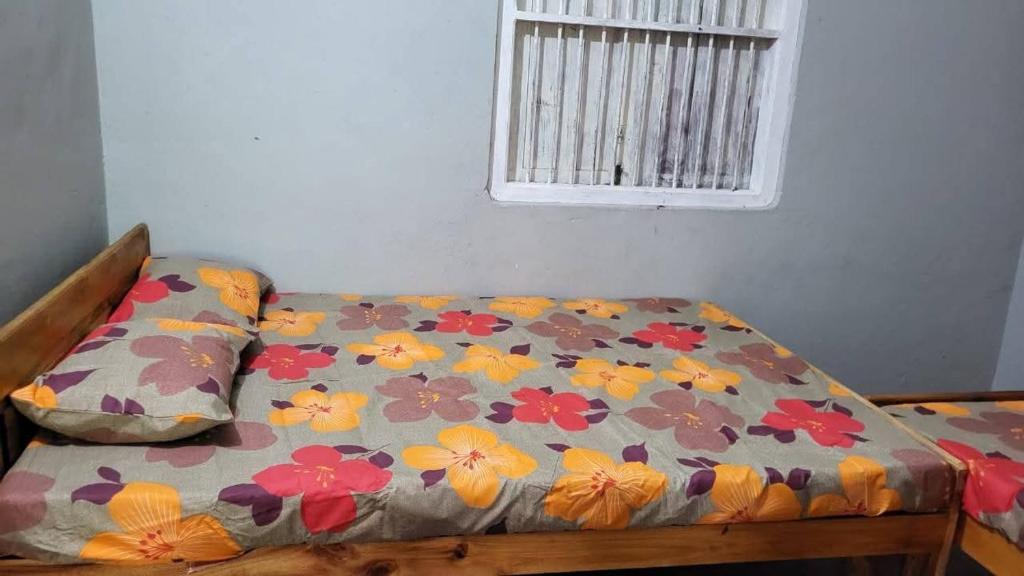 Ένα ή περισσότερα κρεβάτια σε δωμάτιο στο Delft Av home stay and food provider
