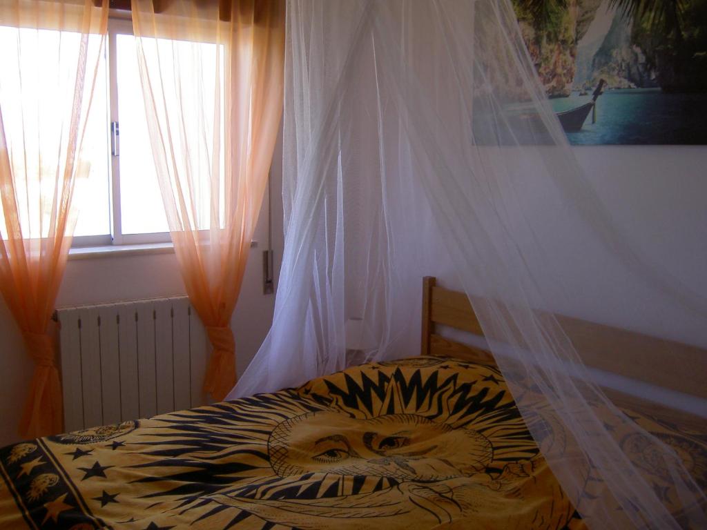 Postel nebo postele na pokoji v ubytování Quartos Com Boas Vistas