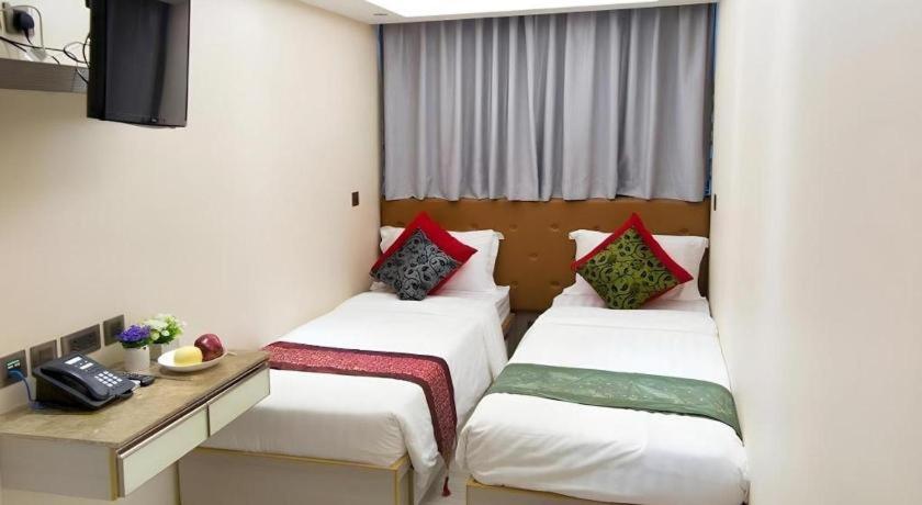 Ένα ή περισσότερα κρεβάτια σε δωμάτιο στο Metroplace Boutique