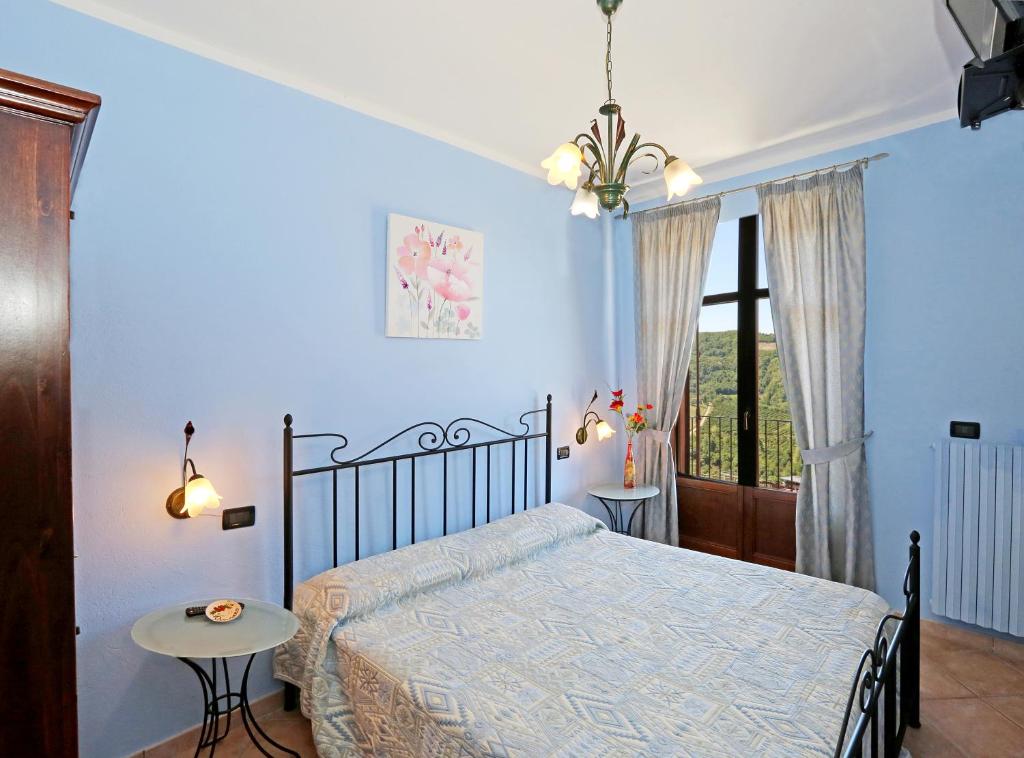 Postel nebo postele na pokoji v ubytování Agriturismo Al Brich