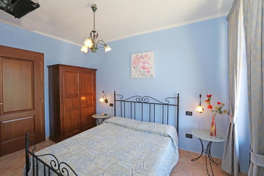 Postel nebo postele na pokoji v ubytování Agriturismo Al Brich