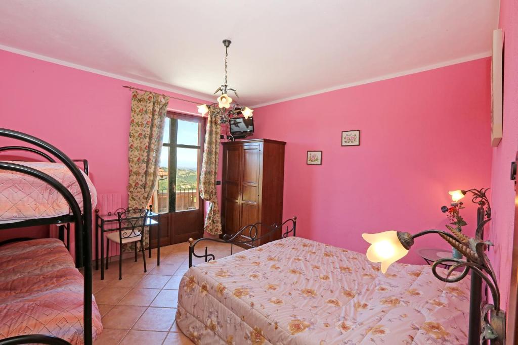 Postel nebo postele na pokoji v ubytování Agriturismo Al Brich