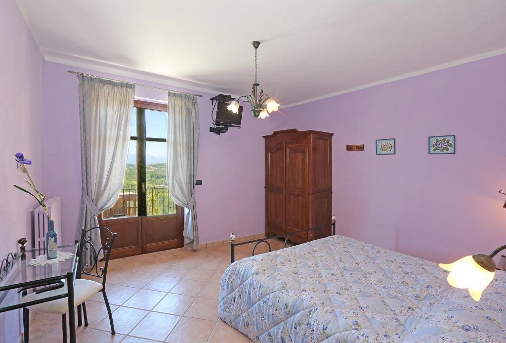 Postel nebo postele na pokoji v ubytování Agriturismo Al Brich