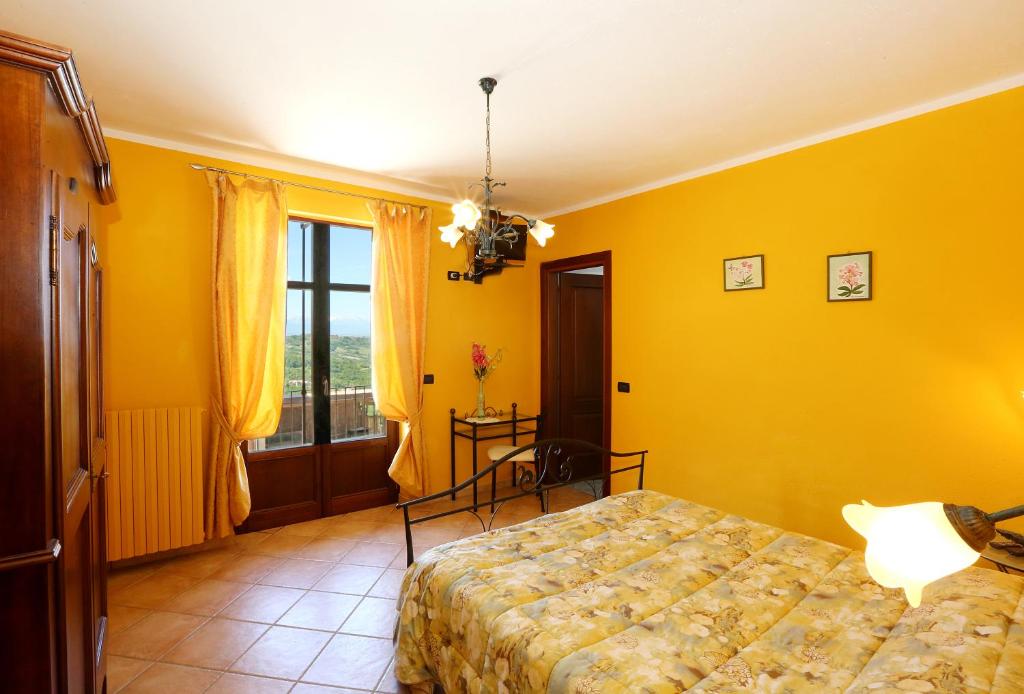 Postel nebo postele na pokoji v ubytování Agriturismo Al Brich