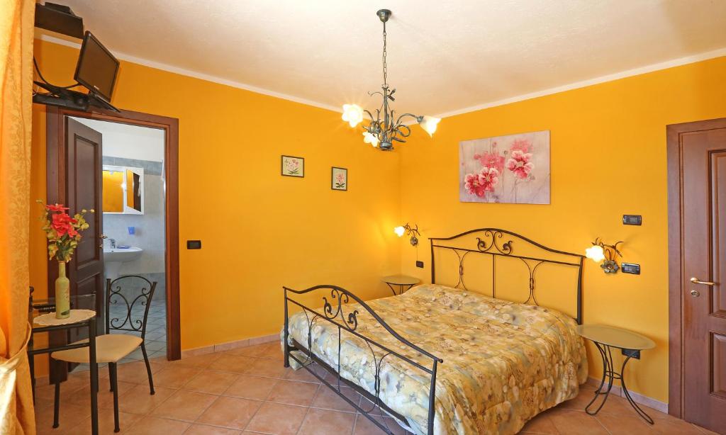 Postel nebo postele na pokoji v ubytování Agriturismo Al Brich