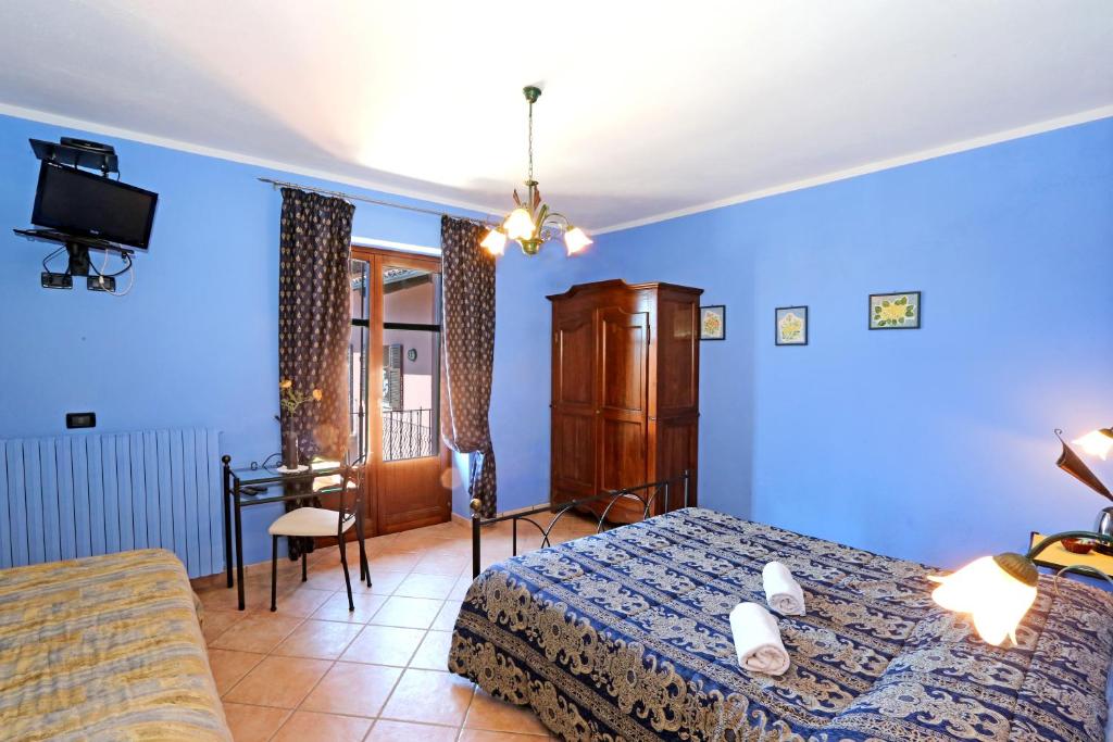 Postel nebo postele na pokoji v ubytování Agriturismo Al Brich