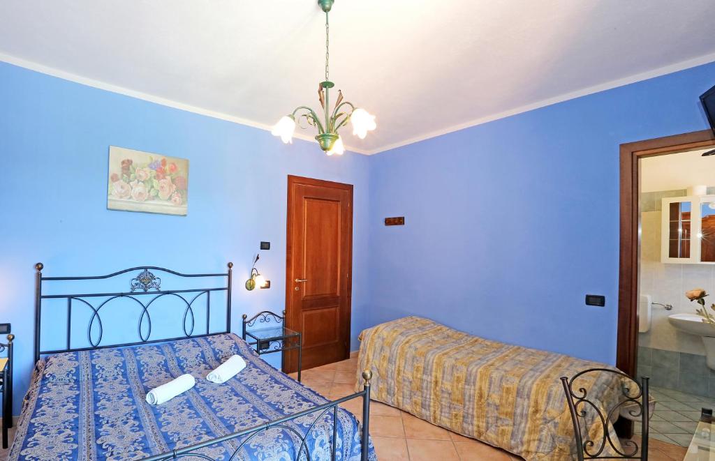 Postel nebo postele na pokoji v ubytování Agriturismo Al Brich
