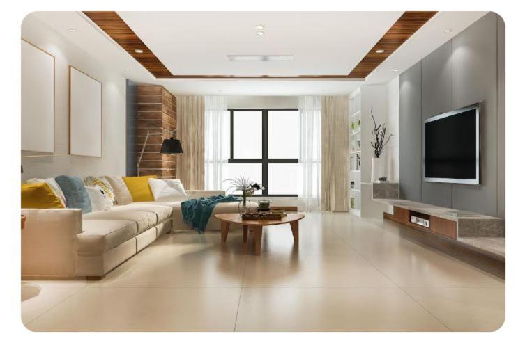 ein Wohnzimmer mit Sofa und Fernseher in der Unterkunft Test Property Name 