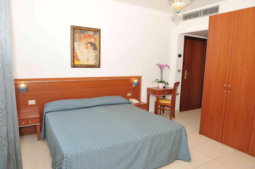 Postel nebo postele na pokoji v ubytování Hotel Abruzzo