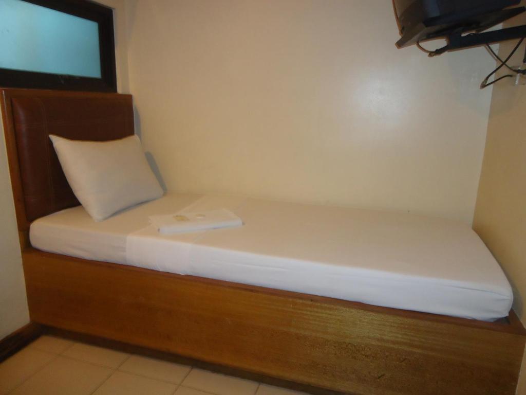 Postel nebo postele na pokoji v ubytování Park Bed and Breakfast Hotel Pasay