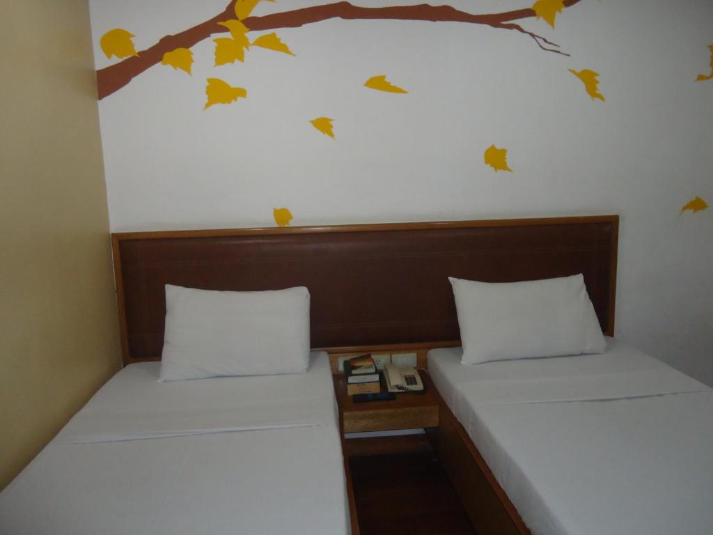 Postel nebo postele na pokoji v ubytování Park Bed and Breakfast Hotel Pasay