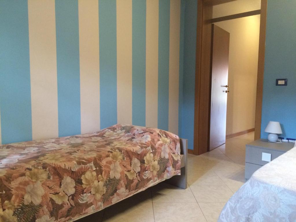 Posteľ alebo postele v izbe v ubytovaní Appartamento Arco