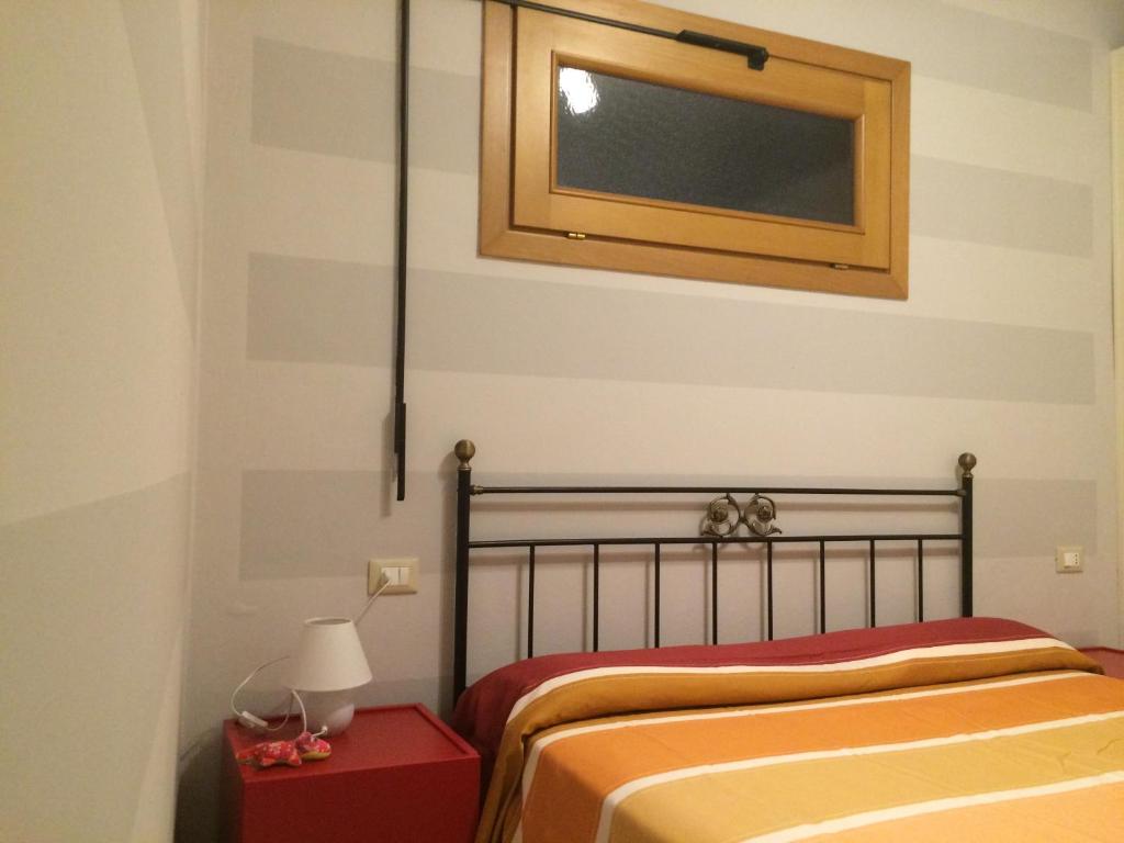 Posteľ alebo postele v izbe v ubytovaní Appartamento Arco