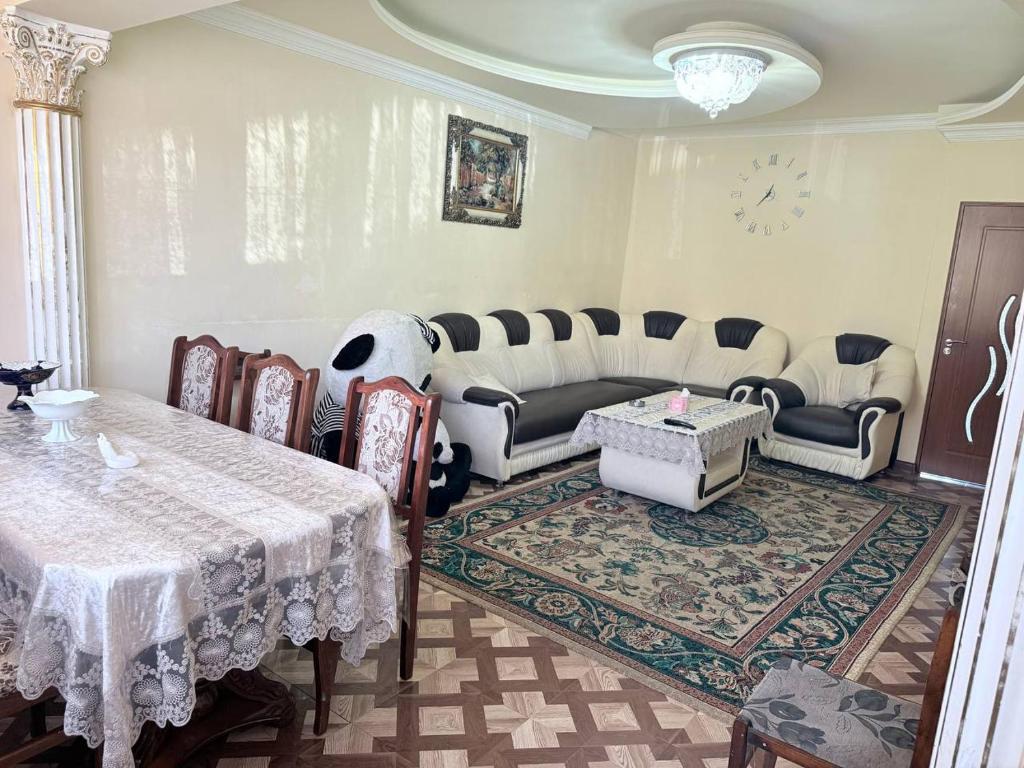 a living room with a table and a couch at SweetHome in Sevan