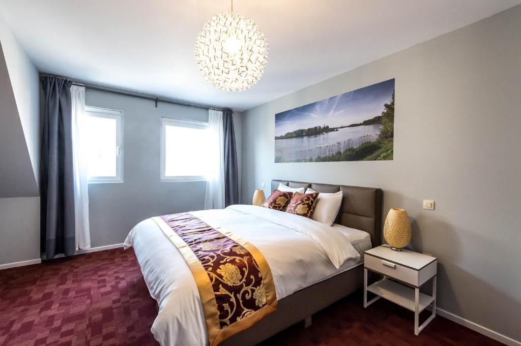 Postel nebo postele na pokoji v ubytování Hotel Temse