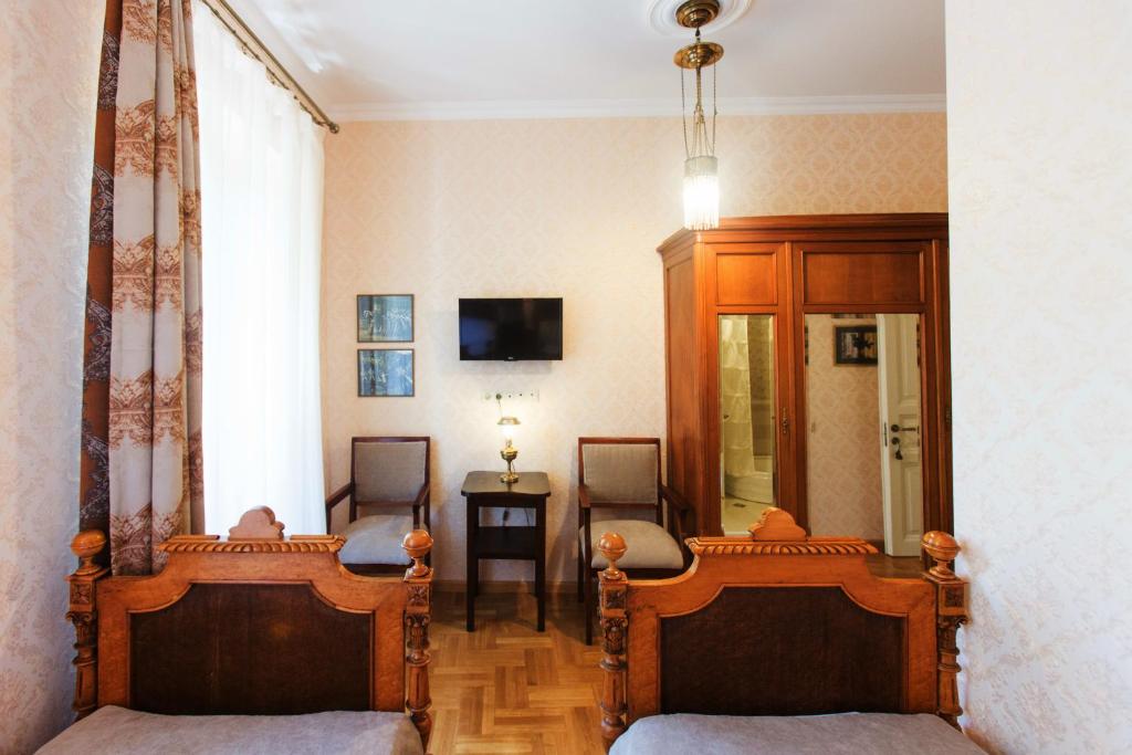 TV a/nebo společenská místnost v ubytování Bloom Boutique Hotel