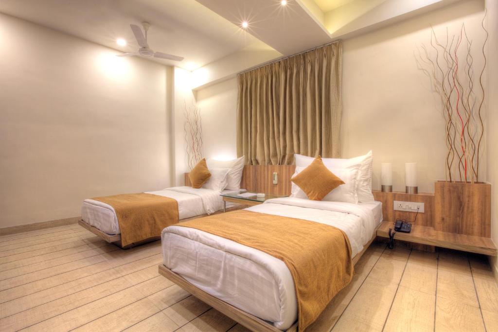 Postel nebo postele na pokoji v ubytování Scenaria Hotel