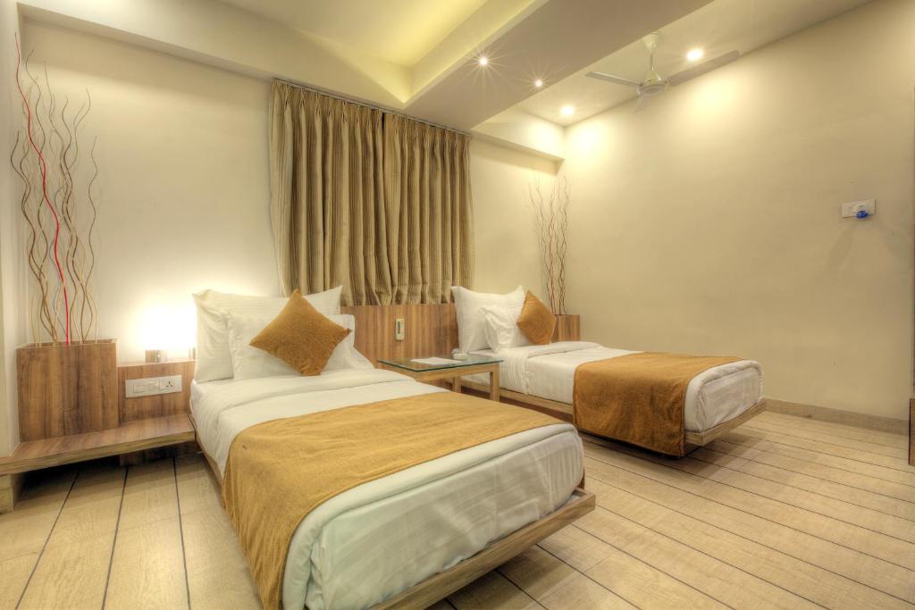 Postel nebo postele na pokoji v ubytování Scenaria Hotel