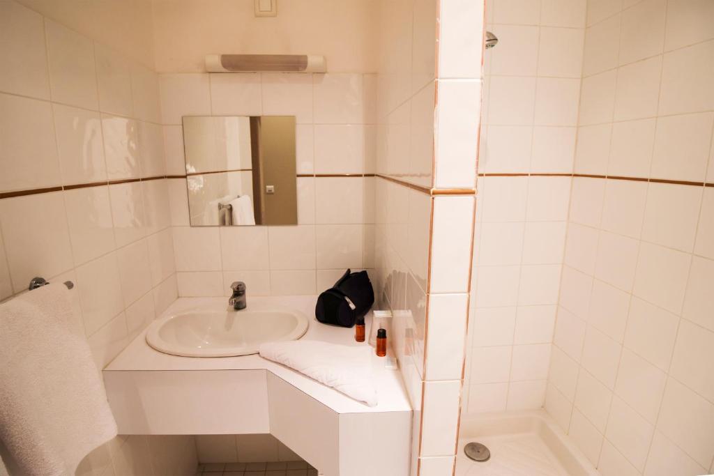 Koupelna v ubytování Ambiance Hotel
