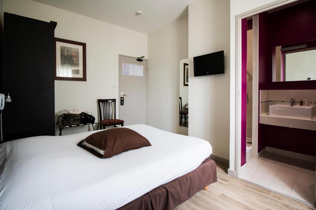 Postel nebo postele na pokoji v ubytování Ambiance Hotel